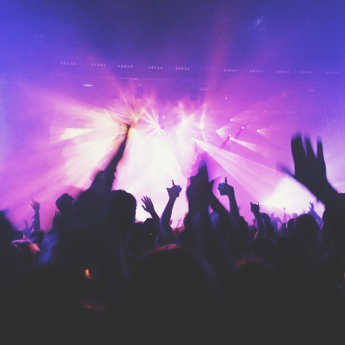 Concert crowd and stage with purple lights